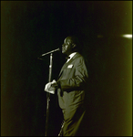 Louis Armstrong Speaking into Microphone and Holding a Rag, Tampa, Florida by George Skip Gandy IV