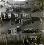 Men Working on Helco Safety Equipment Corporation and American Optical Exhibits, Tampa, Florida, A by George Skip Gandy IV