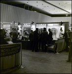 Men Viewing Welsh Manufacturing Company Exhibit, Tampa, Florida by George Skip Gandy IV