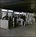 Men Talking in Front of Construction and Safety Exhibits, Tampa, Florida by George Skip Gandy IV