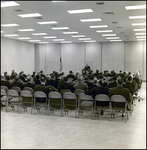 Sitting Crowd Watching Man Speak at Podium, Tampa, Florida, A by George Skip Gandy IV