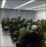 Sitting Crowd Watching Man Speak at Podium, Tampa, Florida, C by George Skip Gandy IV