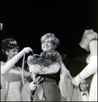 Women Placing Tassel and Cape on Nadine Williams, Tampa, Florida by George Skip Gandy IV