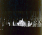 Woman Standing in Ring of Light While Surrounded by Miss Tampa Contestants Onstage, Tampa, Florida by George Skip Gandy IV