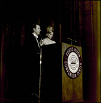 Man and Woman Standing at Podium, Tampa, Florida by George Skip Gandy IV