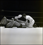 Men Grappling in Wrestling Ring While Referee Watches, Tampa, Florida by George Skip Gandy IV