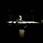 Men Grappling in Wrestling Ring While Referee Approaches Them, Tampa, Florida by George Skip Gandy IV