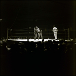 Men Grappling in Wrestling Ring While Referee Watches, Tampa, Florida by George Skip Gandy IV