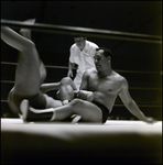 Men Grappling in Wrestling Ring While Referee Watches, Tampa, Florida by George Skip Gandy IV