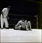 Men Grappling in Wrestling Ring While Referee Watches, Tampa, Florida by George Skip Gandy IV