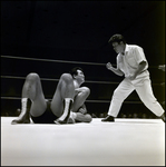 Men Grappling in Wrestling Ring While Referee Approaches Them, Tampa, Florida by George Skip Gandy IV