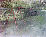 Empty Metal Swing Set Near Fence, Tampa, Florida, C by George Skip Gandy IV