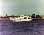 Boat Moving Along Waterway, Tampa, Florida, A by George Skip Gandy IV