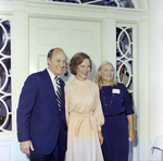 Rosalynn Carter Poses with a Couple Outside in Front of a House, A by George Skip Gandy IV