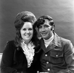 Darlene Castle Poses with Chuck Burns, A by George Skip Gandy IV