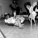 Group of Dancers Dance the Limbo While a Band Plays On, B by George Skip Gandy IV