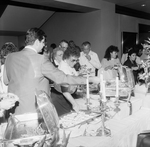 Party-Goers Serving Food from a Chafing Dish Buffet, B by George Skip Gandy IV