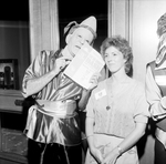 A Man Dressed as a Conehead Talks to a Woman by George Skip Gandy IV