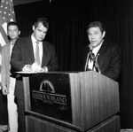 A Man Gives a Speech While Another Man Takes Notes by George Skip Gandy IV