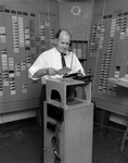 A Man Operates Punchcard Computer for Central Truck Lines by George Skip Gandy IV