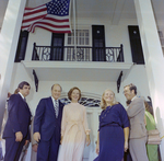 Rosalynn Carter Poses with a Group Outside in Front of a House, A by George Skip Gandy IV