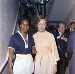 Rosalynn Carter Poses with a Woman in Front of a Stairwell, A by George Skip Gandy IV