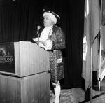 A Man in a Period Costume Speaks From a Podium by George Skip Gandy IV