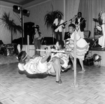 Group of Dancers Dance the Limbo While a Band Plays On, A by George Skip Gandy IV