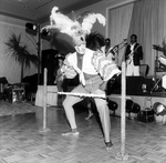 A Dancer, Dressed Possibly in a Calypso Outfit, Prepares to Dance the Limbo