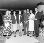 Two Flight Attendants and Airplane Pilot Pose with Others, A by George Skip Gandy IV