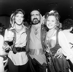 Two Women in Costume Pose with a Bearded Man Dressed as a Pirate by George Skip Gandy IV