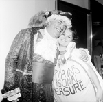 A Man Wearing a Costume Hugs a Woman by George Skip Gandy IV