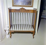 Loveseat Bench with Striped Green Upholstery Next to White Cherub Statue, B by George Skip Gandy IV