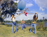 Two Men and a Woman Play a Balloon Launching Game, A by George Skip Gandy IV