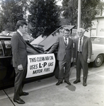 Three Individuals Next to Dancey Co Clean Air Car at City Hall, B by George Skip Gandy IV