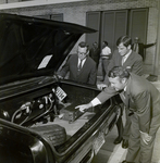 Three Individuals at City Hall Inspect Under Hood of Dancey Co Clean Air Car, C by George Skip Gandy IV