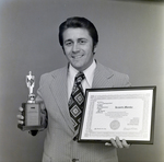 Kenneth Monska Holds Distinguished Salesman Award and Trophy, B by George Skip Gandy IV