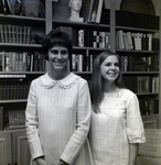 Two Delta Delta Delta Sorority Members Pose in Front of Bookshelf, B by George Skip Gandy IV