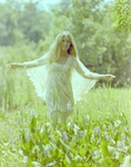 Janet Ducta in a White Dress in a Flowerbed, G by George Skip Gandy IV