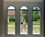 Two people Conversing Through Arched Windows by George Skip Gandy IV