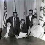 Group Reviweing Documents, B by George Skip Gandy IV