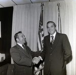 Handshake Between Two Businessmen in Front of Flags, A by George Skip Gandy IV