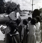 Man with a Group of Kids, B by George Skip Gandy IV