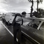 Man Engaging with a Vehicle, B by George Skip Gandy IV