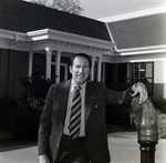 Business Professional in Front of Building, C by George Skip Gandy IV