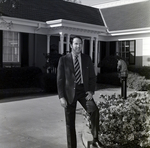 Business Professional in Front of Building, G by George Skip Gandy IV