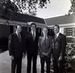 Four Business Men in Front of Building, A by George Skip Gandy IV