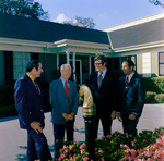 Four Business Men in Front of Building, D by George Skip Gandy IV