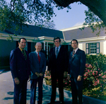 Four Business Men in Front of Building, F by George Skip Gandy IV