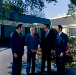 Four Business Men in Front of Building, G by George Skip Gandy IV